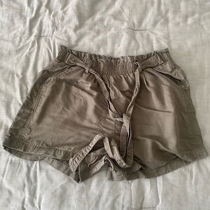 Olive green shorts with elastic waist and pockets